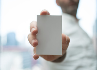 Hand hold blank white card mockup. Plain call-card mock up template holding arm. Plastic credit namecard display front. Check offset card design. Business branding.
