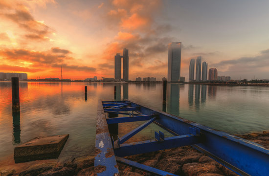 Abu dhabi skyline at the sunrise 