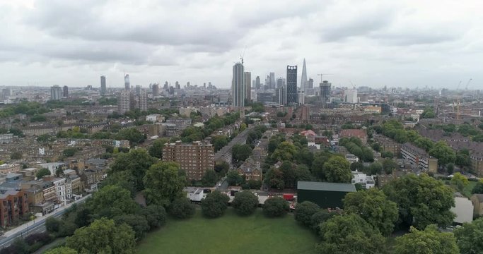 Aerial dolly view of the skyline of the City of London from the South