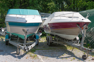 two motor boats on trailers