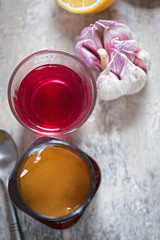 Flu remedy: manuka honey, blackcurrant hot drink, garlic and lemon 