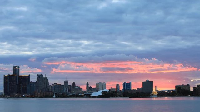 Timelapse of Detroit Skyline from Belle Island at sunset 4K