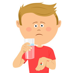 Unhappy little boy with glass of water shows two pils