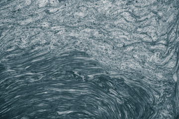An abstract pattern of a foam forming in the river. Beautiful abstract monochrome background pattern.