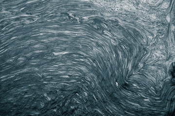 An abstract pattern of a foam forming in the river. Beautiful abstract monochrome background pattern.