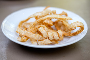Crispy pork rind / pork crackling (Kab Moo) is snack made of deep fried pork skin. Famous food in Chiang Mai in Northern Thailand.