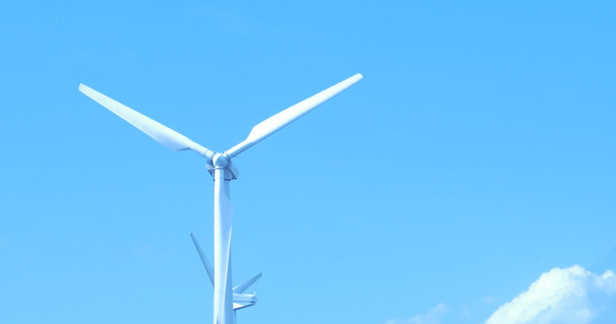 Wind Turbine for alternative energy on background sky