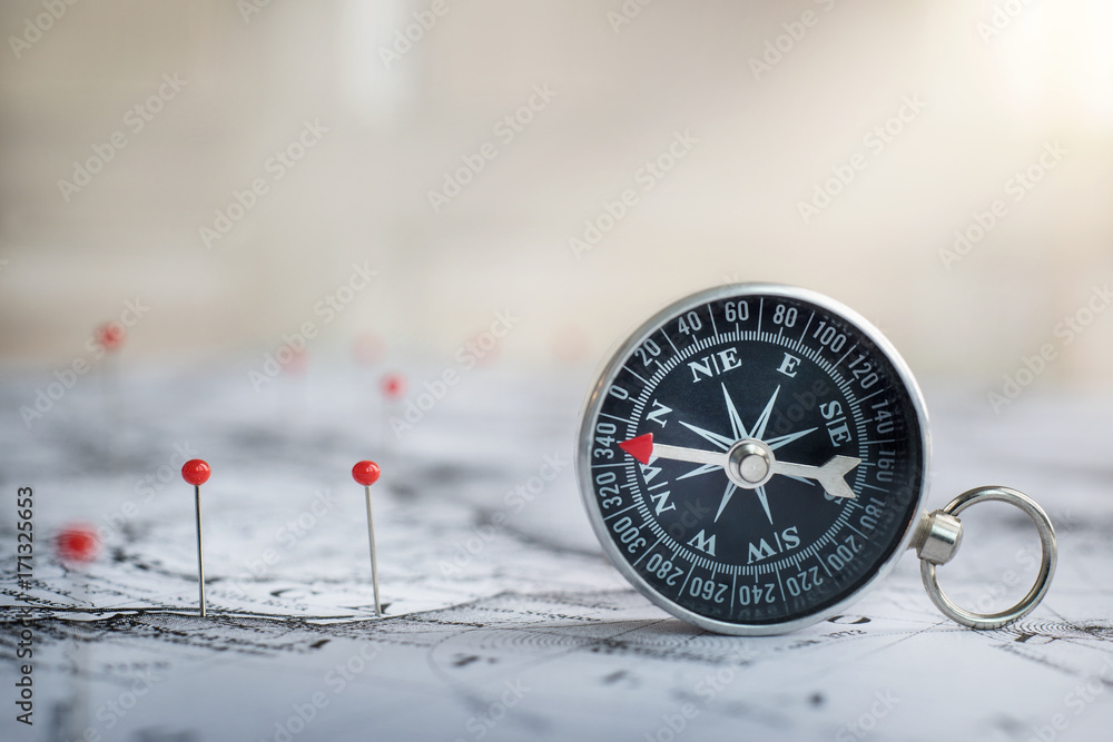 Poster retro compass on ancient map background. travel geography navigation concept background.