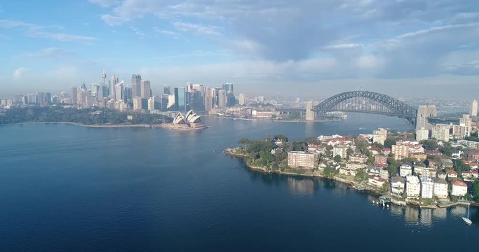 Early morning fly to Kirribilli residential suburn on shores of Sydney harbour with major CBD landmarks on horizon.
