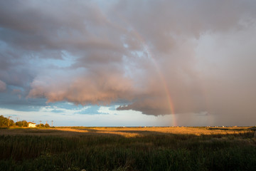 Fototapeta na wymiar Double rainbow after storm, in Gura Portitei, Romania