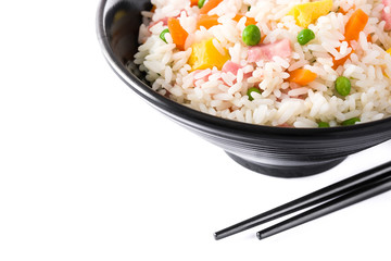 Chinese fried rice with vegetables and omelette in black bowl isolated on white background

