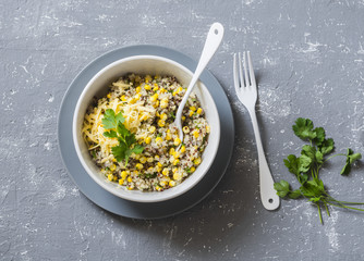 Mexican quinoa corn salad cheese on grey background, top view. Vegetarian food concept © okkijan2010