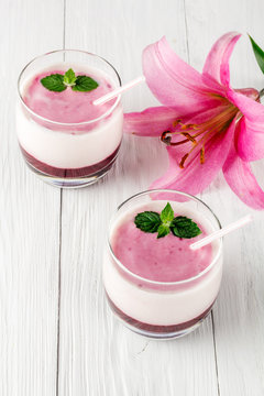 Berry smoothie with yogurt and flower