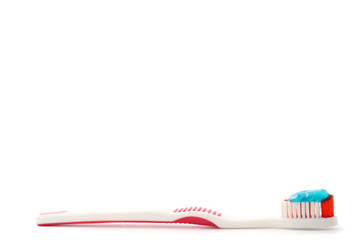Toothbrush with toothpaste on a white background. Free space for text