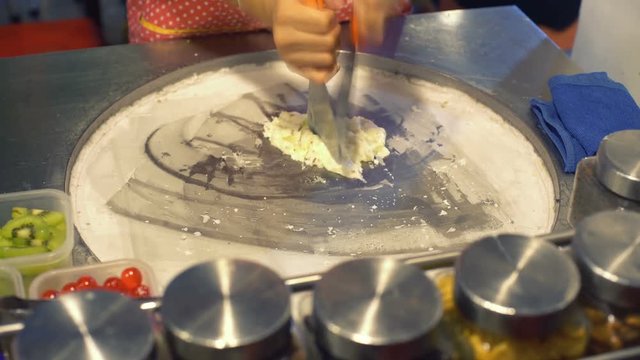 Making ice cream rolls on cold plate 4k UHD (3840x2160)
