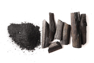 Charcoal and powder (activated carbon) on white background.