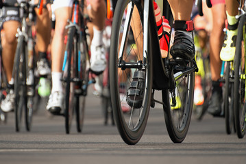 Fototapeta na wymiar Cycling competition,cyclist athletes riding a race,detail cycling shoes