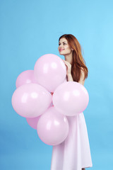 Fototapeta na wymiar adorable woman holds balloons