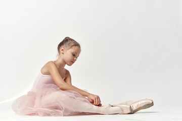little ballerina doing stretching