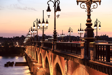 Pont de Pierre bridge at twulight, Bordeaux, France