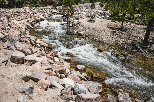 Source of a mountain river. Picturesque water stream in the Rocky Mountains
