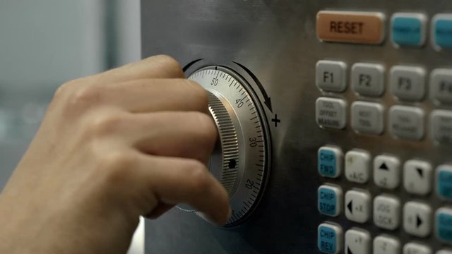 Hands industrial engineer using computer numerical control. Cnc machine