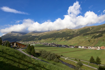 Obraz premium Town at the foot of the mountains, Livigno, Italy