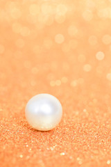Naklejka na ściany i meble Pile of pearls on golden christmas background