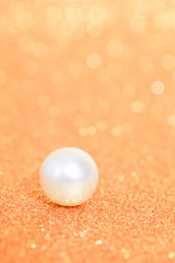Pile of pearls on golden christmas background