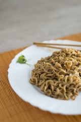 Yakisoba / noodles with beef in rectangle plate with bamboo stic