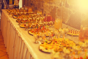Wedding tables with decoration and dishes in the restaurant. Vintage tone