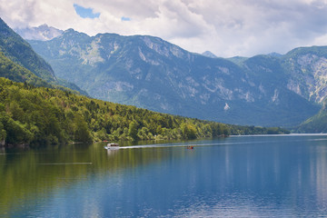 View of lake Bohinj in Slovenia with the ship sailing across it