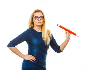 Woman confused thinking, big pencil in hand