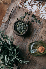 Sliced bread with butter on wooden background and the scattered seeds.