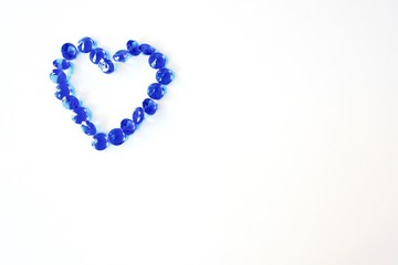 Fototapeta na wymiar Beautiful heart of blue diamonds on the white background