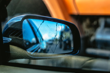 Closeup of damaged rear view mirror