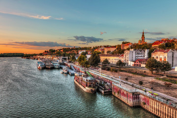 Concrete ship in Belgrade's port and sunset. HDR image - obrazy, fototapety, plakaty