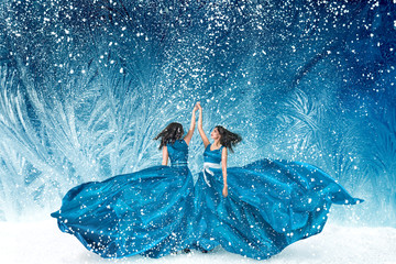 Two beautiful women dancing in fairy tale forest