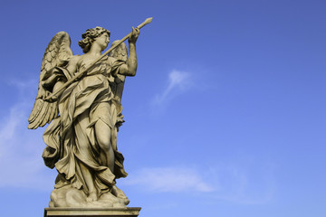 Medieval figure of an angel on the famous bridge Saint Angelo bridge, Rome, Italy