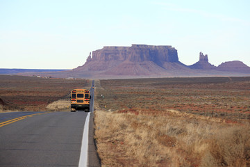 School bus running to Monument Valley