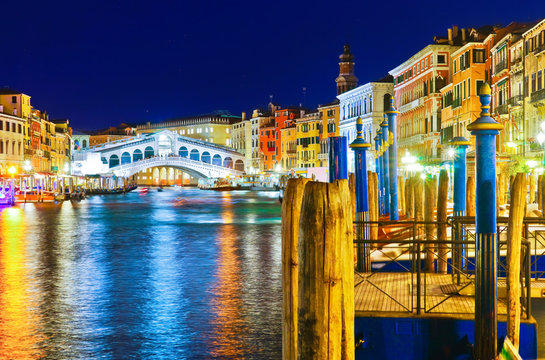 View of the Rialto Bridge and Grand Canal in Venice at night