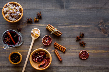 Ingredients mulled wine or grog with spices and citrus for winter evening. Christmas new year eve. Wooden background top view. Mockup
