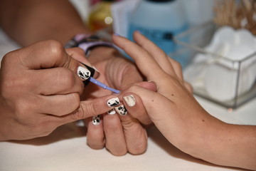 Obraz premium Manicure painting fingernails beauty salon