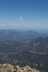 view of the sailplane flying over the mountains of Corsica