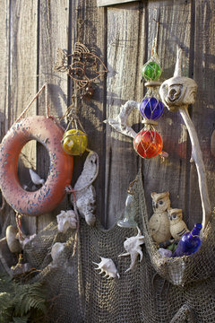 Beach shack exterior decorated with vintage nautical treasures