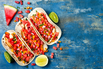 Mexican grilled chicken tacos with watermelon salsa. Copy space