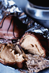 Sweets and desserts, round chocolate sweets with nut cream filling , macro