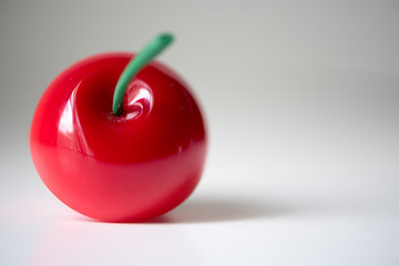 fallen red apple with green stem