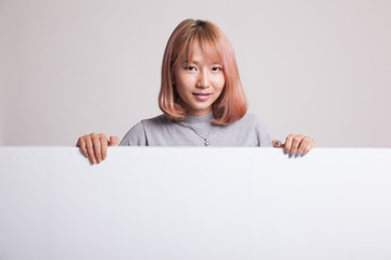Fototapeta premium Young Asian woman with blank sign.