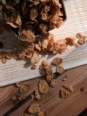 corn flakes placed on wooden mat